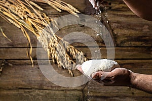 men hands with flour splash. Cooking bread