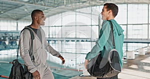 Men, handshake and friends at swimming pool for hello, community or greeting hug. Sports, swimmer and athlete meeting