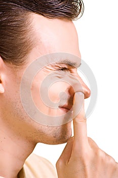 Men has thrust a finger in the nose