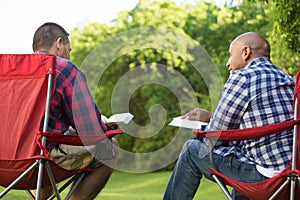 Multi-Ethnic group of friends talking and having a bible study. photo