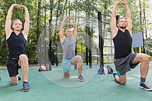 Men having calisthenics workout photo