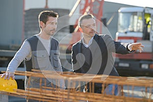 Men having conversation on construction site