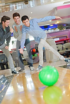 Men having fun in bowling center