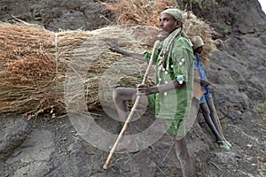 Men with hay bundles, Ethiopia