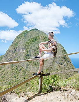 Men hiking in Saint Lucia Caribbean, nature trail in the jungle of Saint Lucia huge Pitons