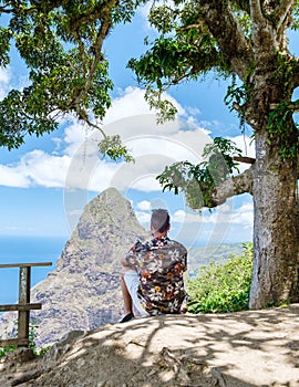 Men hiking in Saint Lucia Caribbean, nature trail in the jungle of Saint Lucia huge Pitons