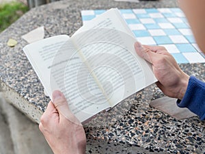 Men holding reading book