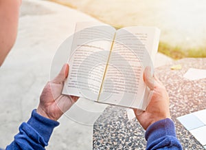 Men holding reading book