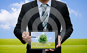 Men holding touch screen tablet technology environment and ecology