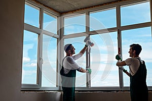 Men are installing a window