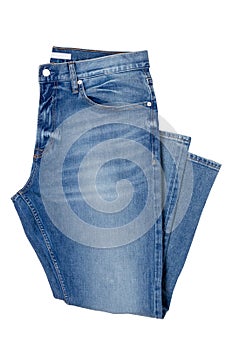 Men jeans isolated. Folded trendy stylish male blue jeans trousers isolated on a white background. Fashionable denim pants.