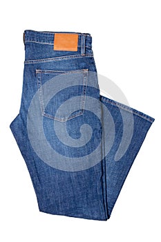 Men jeans isolated. Folded trendy stylish male blue jeans trousers isolated on a white background. Fashionable denim pants for man