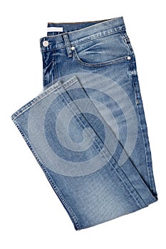 Men jeans isolated. Folded trendy stylish male blue jeans trousers isolated on a white background. Fashionable denim pants.