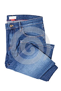 Men jeans isolated. Folded trendy stylish male blue jeans trousers isolated on a white background. Fashionable denim pants for man