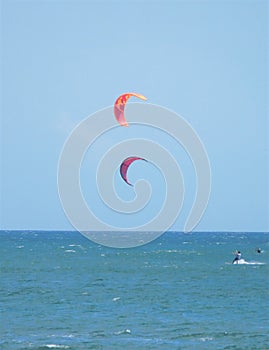 Men kite surfing Canggu Beach Bali