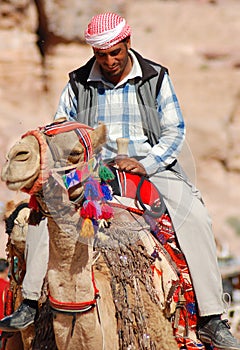 Men looks for tourists for camel ride.