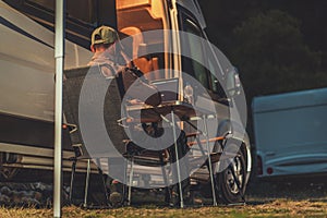 Men Making Business Phone Call While Camper Camping