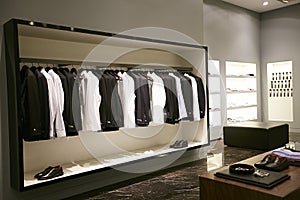 Men male dress on hangers showcases in store photo