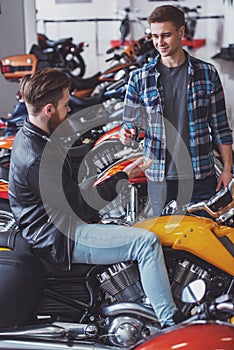 Men in motorbike salon