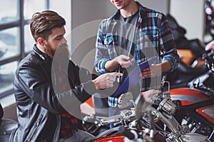 Men in motorbike salon