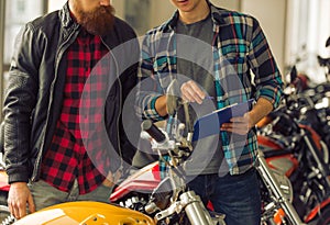 Men in motorbike salon