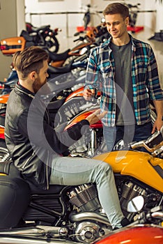 Men in motorbike salon