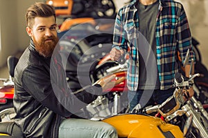 Men in motorbike salon