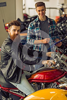 Men in motorbike salon