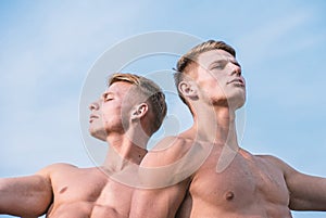 Men muscular chest naked torso sky background. Men muscular athlete bodybuilder relaxing lean each other. Masculinity