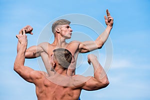 Men muscular chest naked torso stand sky background. Strong muscles emphasize masculinity sexuality. Bodybuilder shape