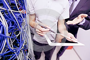 Men in network server room