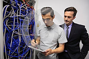 Men in network server room