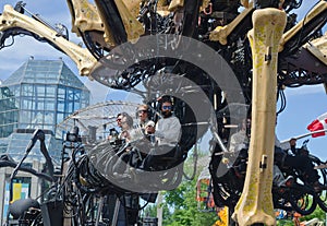 Men operating the legs of Kumo a Giant Spider in Ottawa