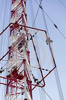 Men painting the highest Czech construction radio transmitter tower Liblice