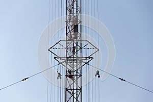 Men painting the highest Czech construction radio transmitter tower Liblice