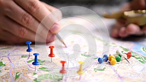 Men planning hiking trip on a map