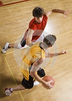 Men Playing Basketball On Indoor Court