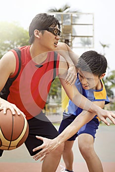 Men playing basketball together. Conceptual image