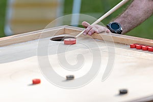 Men playing Novuss. Novuss is a national sport in Latvia similar to pocket billiards or pool