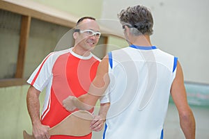 Men playing pelota on trinquete court photo