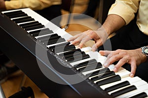 Men playing piano pianos in charity concert shows