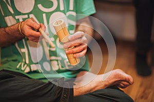 Men playing wooden holz agogo