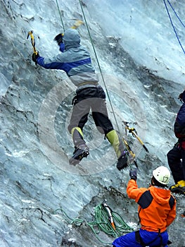 Men practising to climb glacier