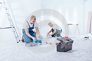 Men preparing interior to renovation