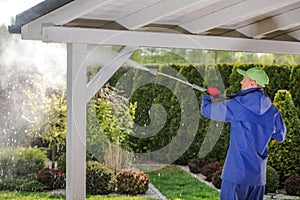 Men Pressure Washing Garden Porch Wooden Roof