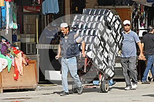 Men pushing a trolley