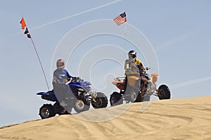 Men With Quad Bikes On Sand Dune