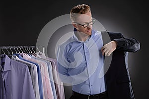 Men in retail store. Confident young businessmen wearing suit in