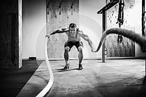 Men with rope in functional training fitness