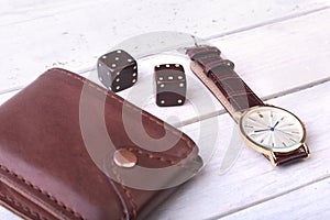 Men`s accessories for business and rekreation. Leather belt, wallet, watch and smoking pipe on wood background.. Top